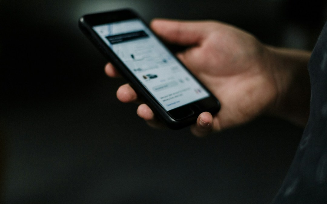person holding black iphone 5