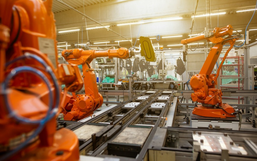 a factory filled with lots of orange machines