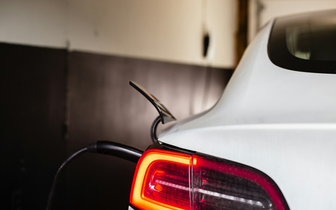 the tail light of a white car in a garage