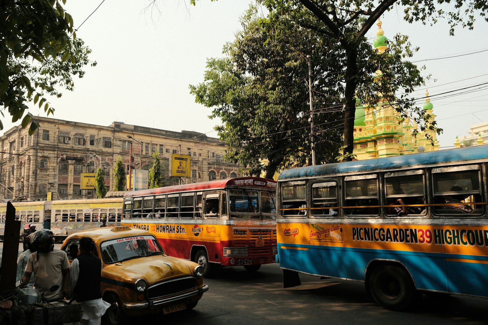a couple of buses that are sitting in the street