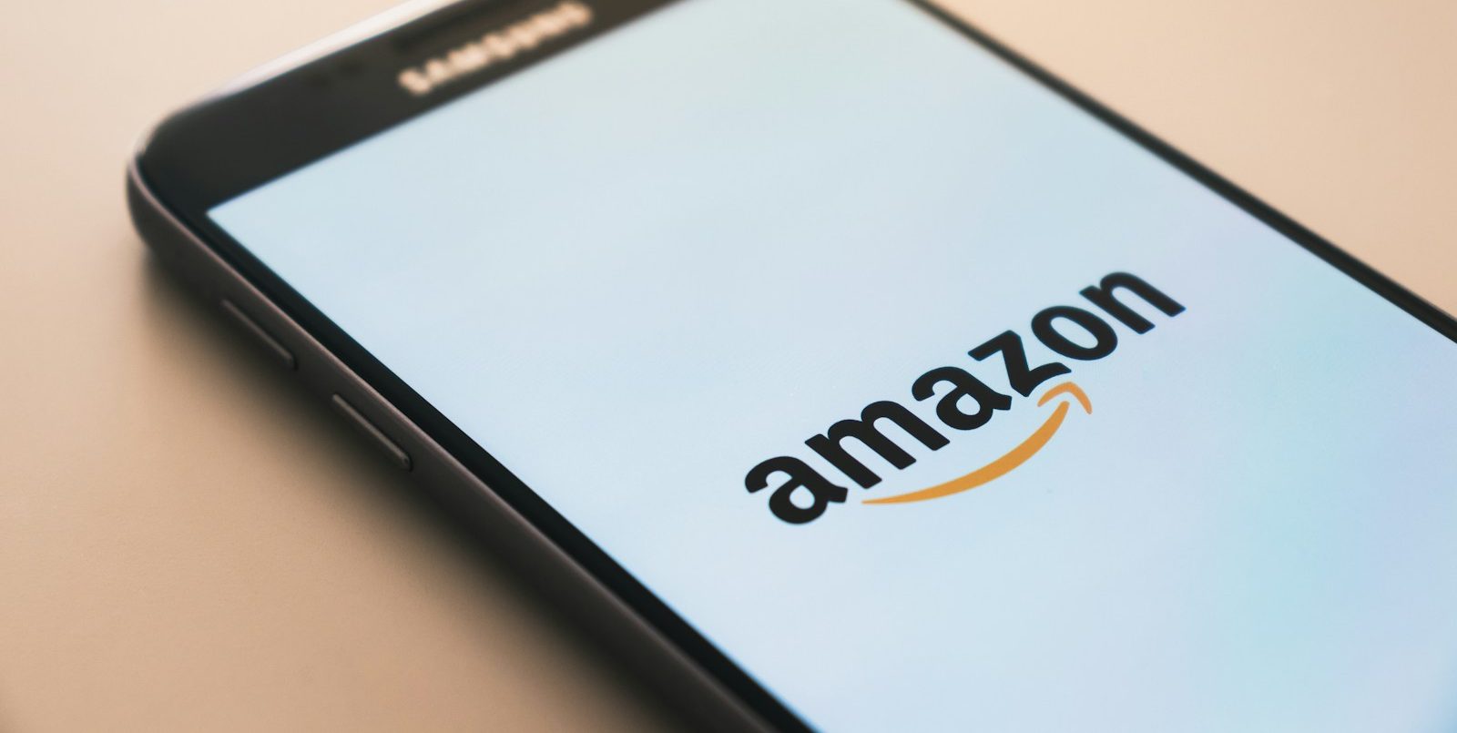 black Samsung Galaxy smartphone displaying Amazon logo